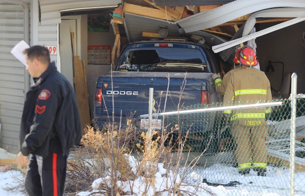 Home after truck crashed into it