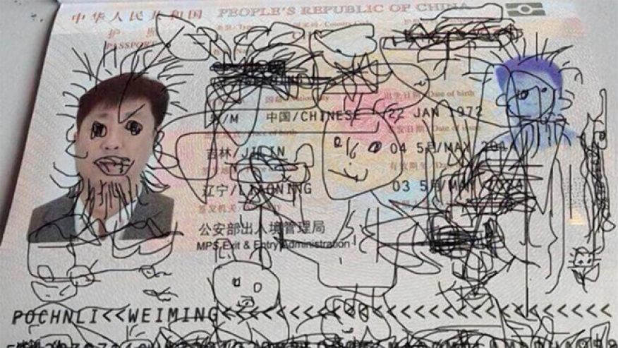 Chinese passport defaced by man's 4-year-old son.