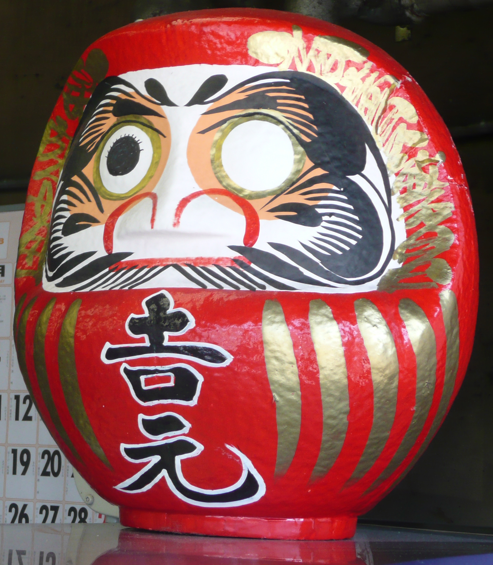 Japanese daruma doll missing one eye.